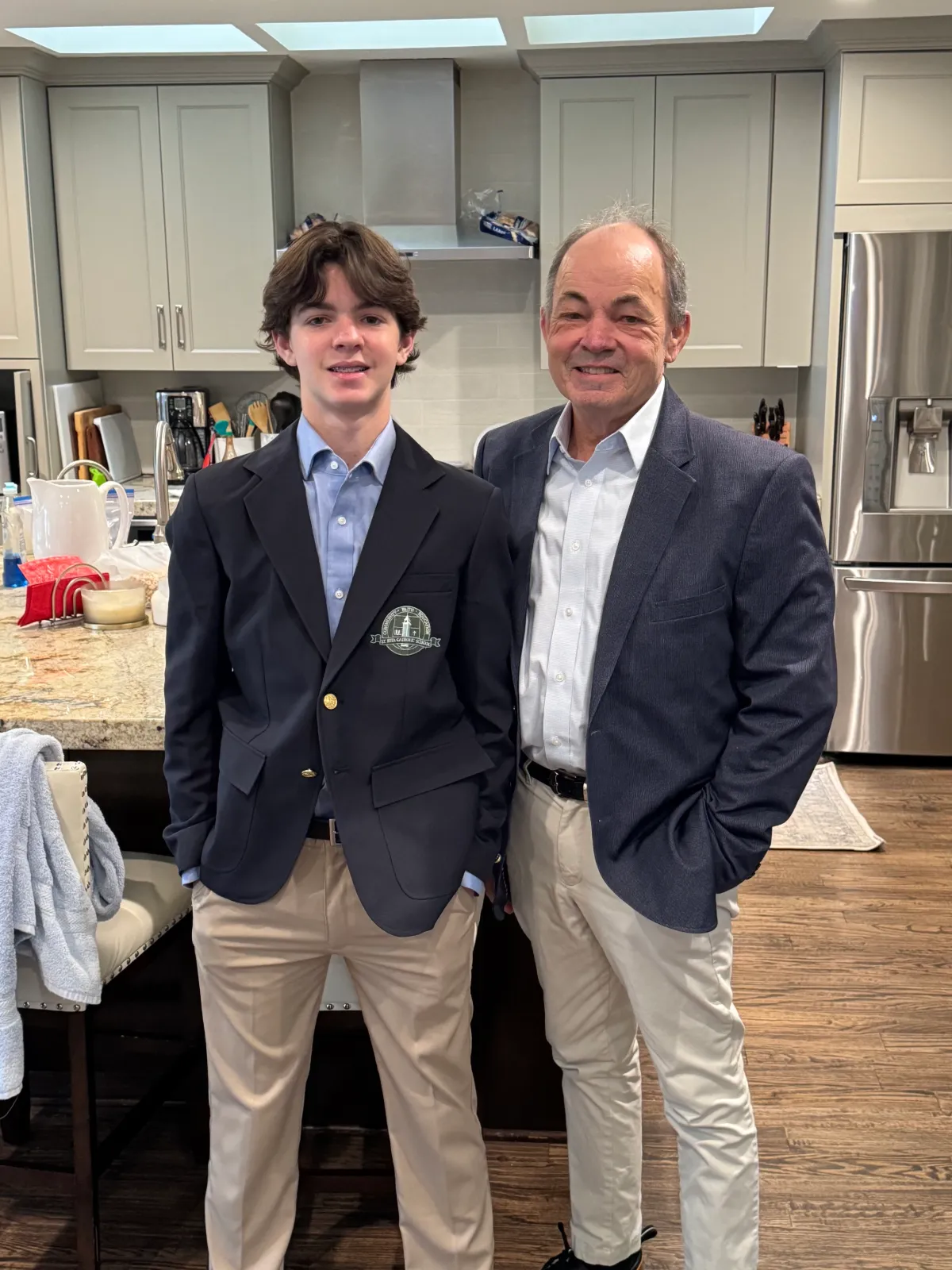 Mike and his son in blazers, at home